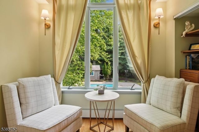 11 Rising Ridge Rd, Upper Saddle River Boro, NJ 07458 - sitting room with a baseboard heating unit and light wood-type flooring