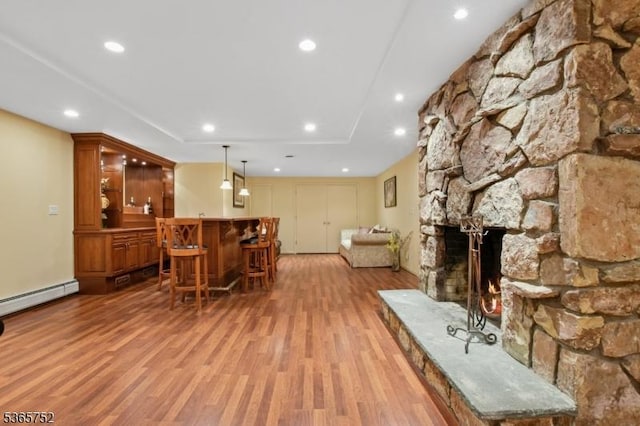 11 Rising Ridge Rd, Upper Saddle River Boro, NJ 07458 - living area featuring bar, light wood finished floors, a baseboard radiator, recessed lighting, and a fireplace
