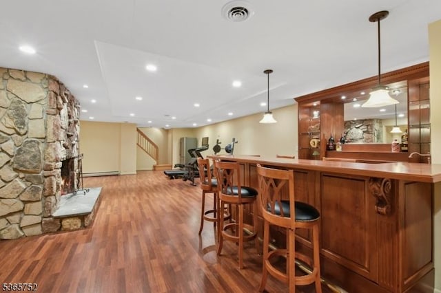 11 Rising Ridge Rd, Upper Saddle River Boro, NJ 07458 - indoor wet bar featuring wood finished floors, baseboard heating, pendant lighting, stairway, and recessed lighting
