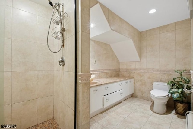 11 Rising Ridge Rd, Upper Saddle River Boro, NJ 07458 - bathroom featuring tile walls, tiled shower, and vanity