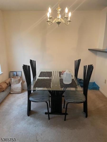 550-552 S 19th St, Newark City, NJ 07103 - dining area featuring a chandelier and carpet