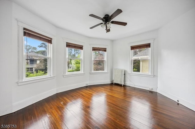 210 Baldwin St, Glen Ridge Boro Twp, NJ 07028 - empty room with radiator heating unit, plenty of natural light, a ceiling fan, and hardwood / wood-style flooring