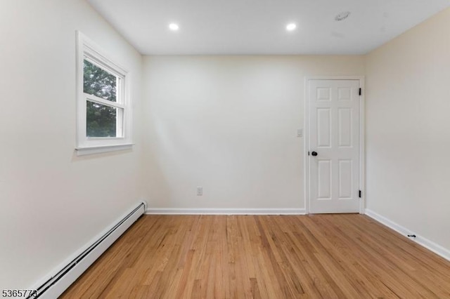 1837 Barnett St, Rahway City, NJ 07065 - spare room with a baseboard heating unit, light wood-style flooring, and recessed lighting