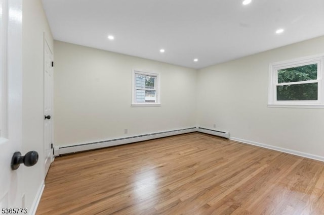 1837 Barnett St, Rahway City, NJ 07065 - spare room with light wood-type flooring, a baseboard radiator, and recessed lighting
