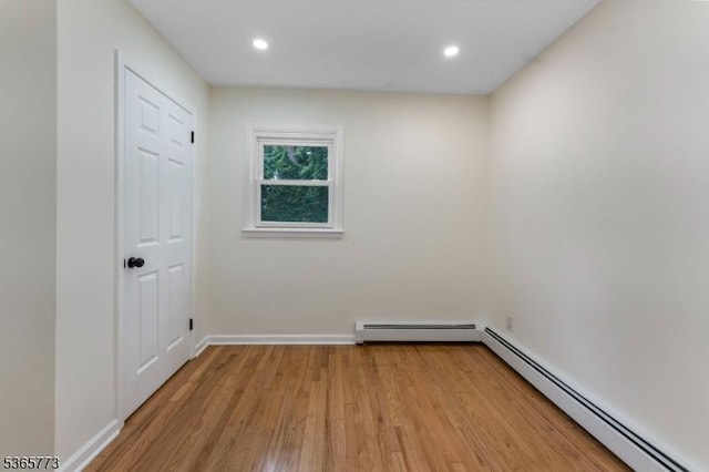 1837 Barnett St, Rahway City, NJ 07065 - unfurnished room with baseboard heating, light wood finished floors, and recessed lighting