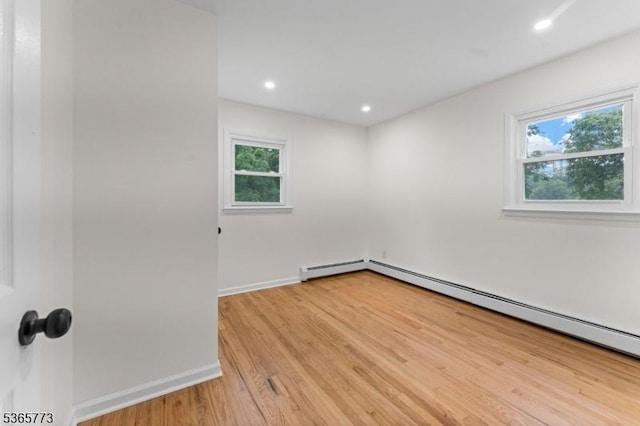 1837 Barnett St, Rahway City, NJ 07065 - spare room with baseboard heating, light wood-style floors, and recessed lighting