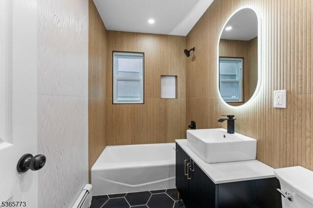 1837 Barnett St, Rahway City, NJ 07065 - bathroom featuring vanity, tile patterned floors, a baseboard radiator, and bathing tub / shower combination