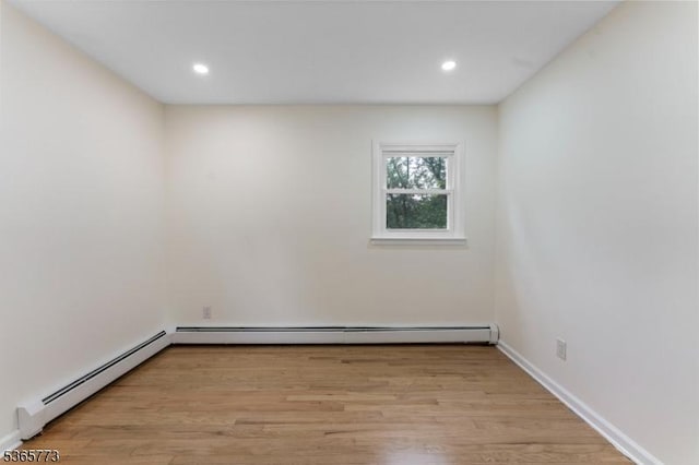 1837 Barnett St, Rahway City, NJ 07065 - spare room with a baseboard heating unit, light wood-type flooring, and recessed lighting