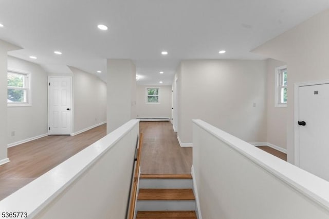 1837 Barnett St, Rahway City, NJ 07065 - hallway featuring wood finished floors, an upstairs landing, recessed lighting, healthy amount of natural light, and a baseboard heating unit