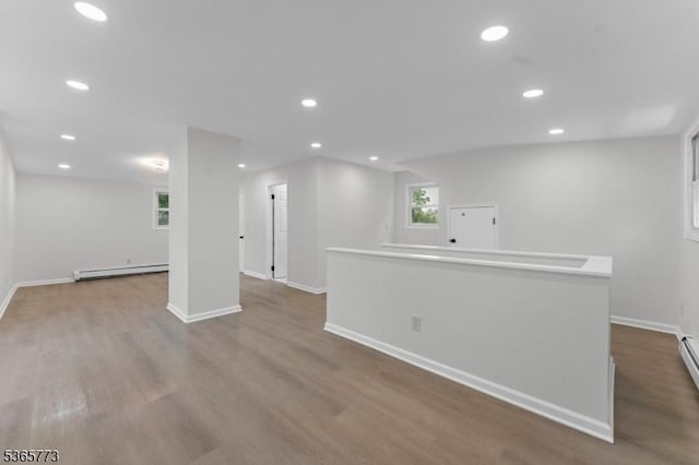 1837 Barnett St, Rahway City, NJ 07065 - basement with baseboard heating, wood finished floors, and recessed lighting