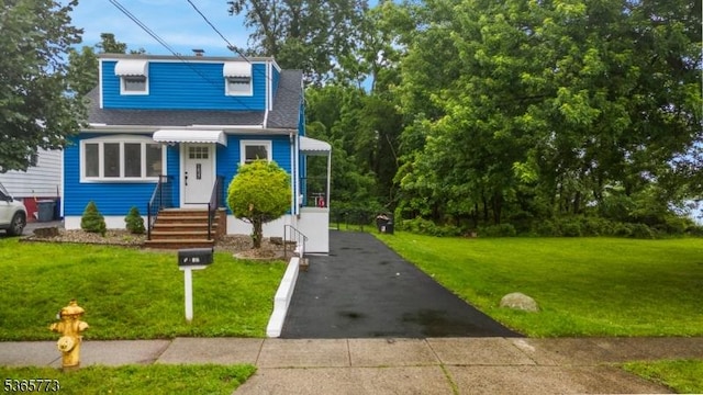 1837 Barnett St, Rahway City, NJ 07065 - view of front of home featuring a front yard, driveway, and a shingled roof