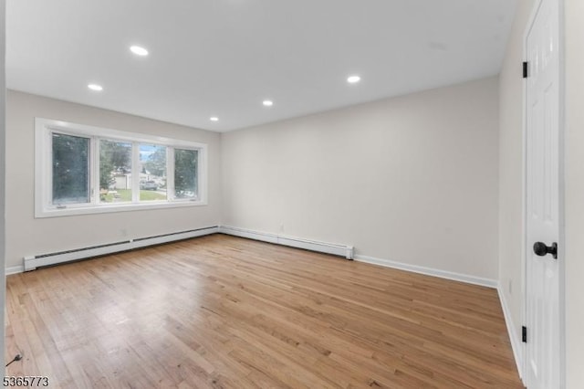 1837 Barnett St, Rahway City, NJ 07065 - unfurnished room featuring wood finished floors, a baseboard heating unit, and recessed lighting