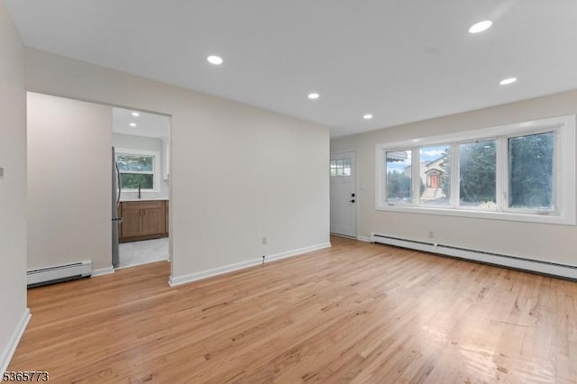 1837 Barnett St, Rahway City, NJ 07065 - empty room with light wood-type flooring, a baseboard radiator, and recessed lighting