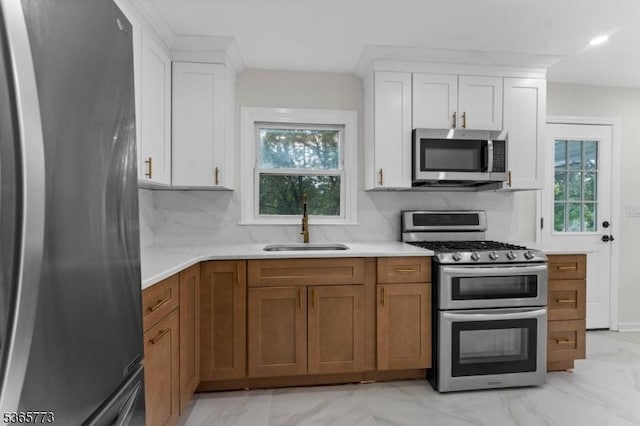 1837 Barnett St, Rahway City, NJ 07065 - kitchen featuring stainless steel appliances, light marble finish floors, light countertops, backsplash, and white cabinets