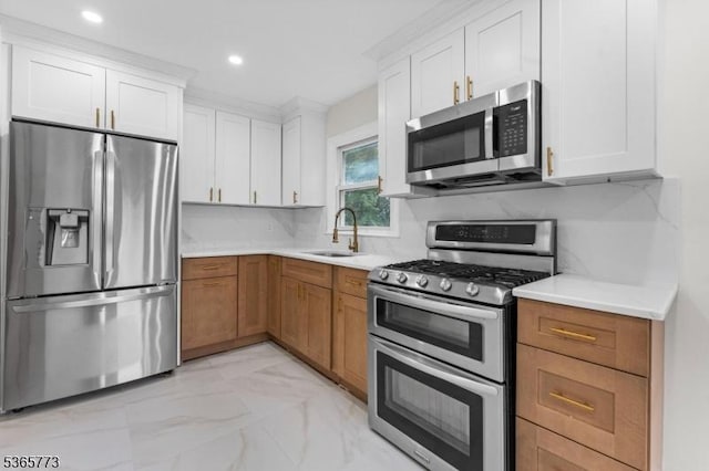 1837 Barnett St, Rahway City, NJ 07065 - kitchen with stainless steel appliances, light countertops, light marble finish floors, white cabinets, and recessed lighting