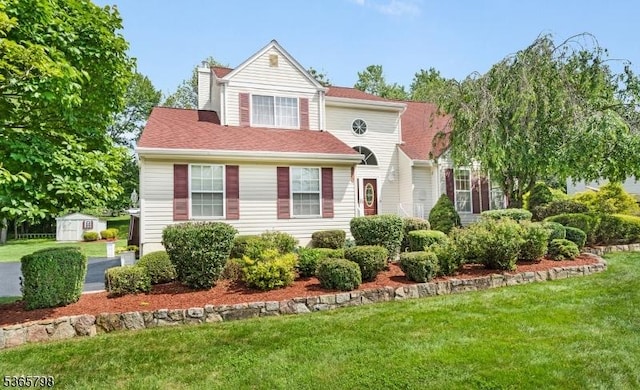 12 Autumn Dr, Mine Hill Twp, NJ 07803 - view of front of property with a front yard and a storage shed