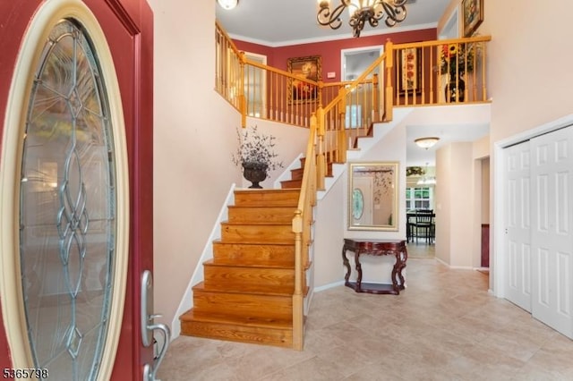 12 Autumn Dr, Mine Hill Twp, NJ 07803 - foyer featuring a chandelier, stairway, and crown molding