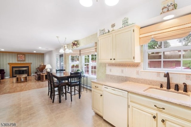 12 Autumn Dr, Mine Hill Twp, NJ 07803 - kitchen featuring white dishwasher, cream cabinets, open floor plan, a fireplace, and light flooring