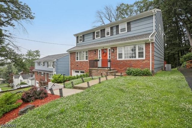 95 Harrison Ave, North Plainfield Boro, NJ 07060 - view of front facade with brick siding and a front lawn