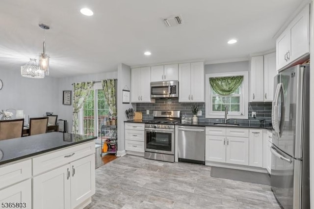 95 Harrison Ave, North Plainfield Boro, NJ 07060 - kitchen with appliances with stainless steel finishes, dark countertops, plenty of natural light, tasteful backsplash, and recessed lighting