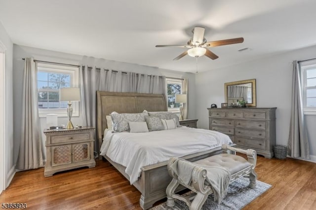 95 Harrison Ave, North Plainfield Boro, NJ 07060 - bedroom featuring multiple windows, wood finished floors, and a ceiling fan