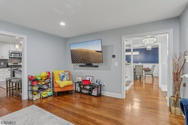 95 Harrison Ave, North Plainfield Boro, NJ 07060 - recreation room with wood finished floors, a chandelier, and recessed lighting