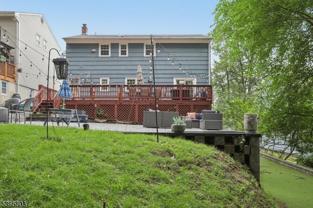95 Harrison Ave, North Plainfield Boro, NJ 07060 - back of property featuring a deck and a lawn