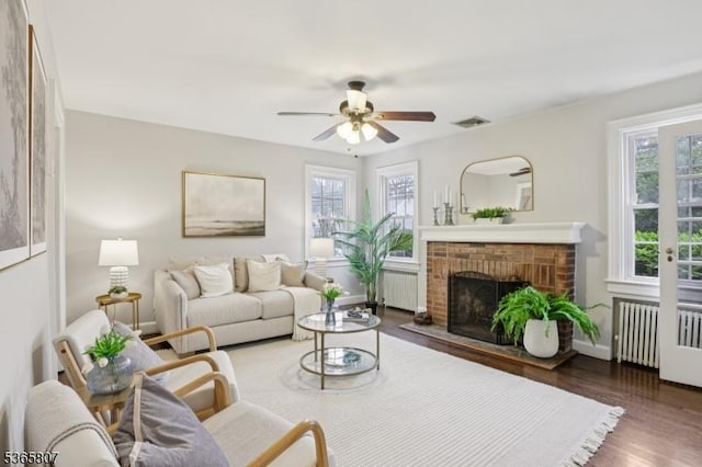 213 Columbia Ave, Cranford Twp, NJ 07016 - living room featuring radiator heating unit, radiator, healthy amount of natural light, and wood finished floors