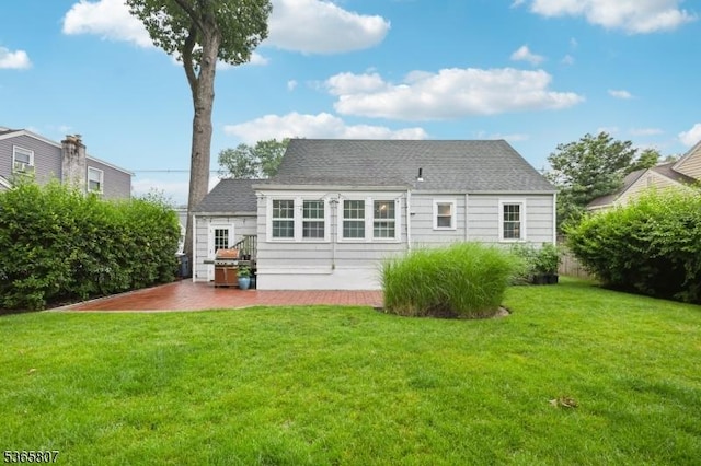213 Columbia Ave, Cranford Twp, NJ 07016 - rear view of house with a lawn, a patio area, and a shingled roof