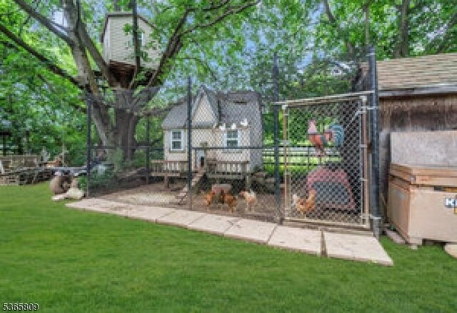 9 Mueller Ln, Franklin Twp, NJ 07882 - view of grassy yard with exterior structure and an outdoor structure