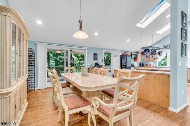 9 Mueller Ln, Franklin Twp, NJ 07882 - dining space featuring a skylight, lofted ceiling, light wood-style floors, and recessed lighting