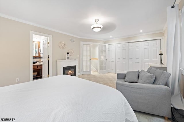 605 E Brookside Ln, Hillsborough Twp, NJ 08844 - bedroom with ornamental molding, a closet, a glass covered fireplace, connected bathroom, and recessed lighting