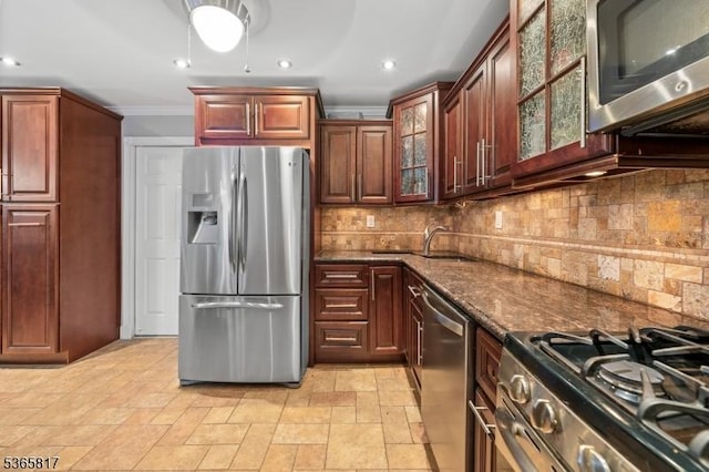 605 E Brookside Ln, Hillsborough Twp, NJ 08844 - kitchen with appliances with stainless steel finishes, crown molding, dark stone counters, decorative backsplash, and glass insert cabinets