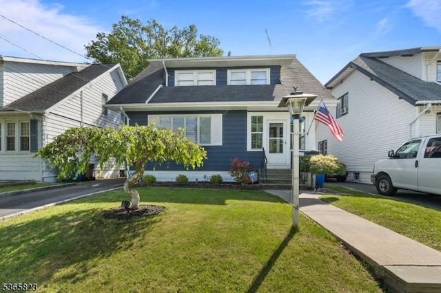 905 Dewitt St, Linden City, NJ 07036 - view of front of home with a front yard and a shingled roof