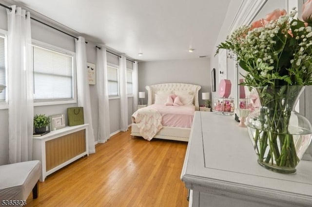 905 Dewitt St, Linden City, NJ 07036 - bedroom with radiator and light wood-type flooring