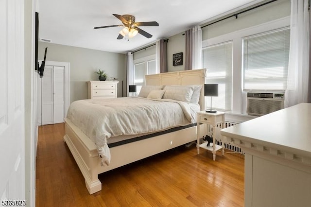 905 Dewitt St, Linden City, NJ 07036 - bedroom featuring radiator heating unit, light wood finished floors, a ceiling fan, and cooling unit