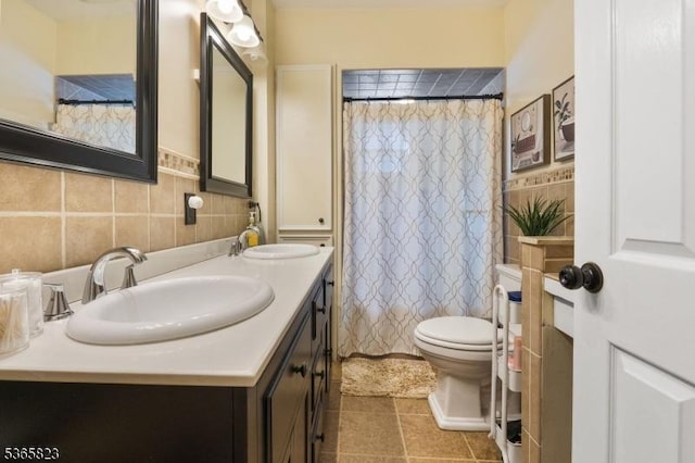 905 Dewitt St, Linden City, NJ 07036 - bathroom featuring double vanity, tile patterned flooring, and tile walls
