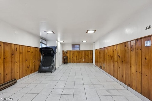 905 Dewitt St, Linden City, NJ 07036 - unfurnished room with wood walls, a baseboard radiator, and a wainscoted wall