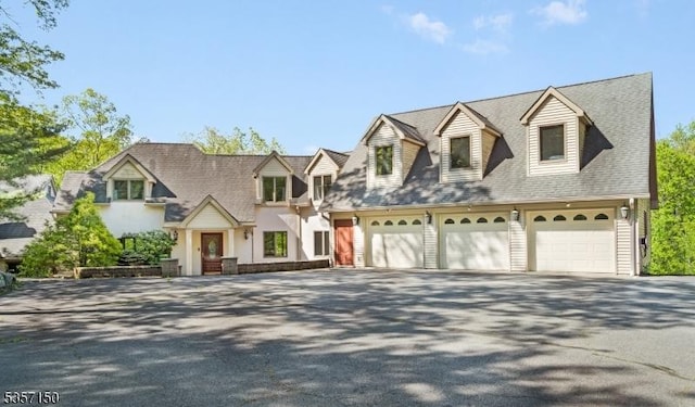 134 Milton Rd, Sparta Twp, NJ 07871 - cape cod home featuring driveway, a shingled roof, and an attached garage