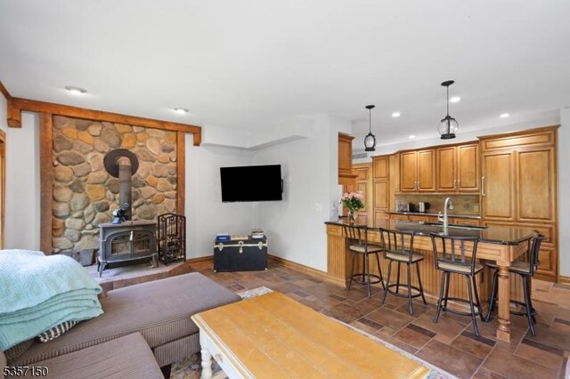 134 Milton Rd, Sparta Twp, NJ 07871 - living room featuring stone finish flooring, a wood stove, and recessed lighting