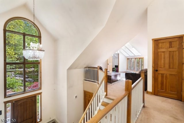 134 Milton Rd, Sparta Twp, NJ 07871 - hall with an upstairs landing, light colored carpet, a chandelier, and high vaulted ceiling