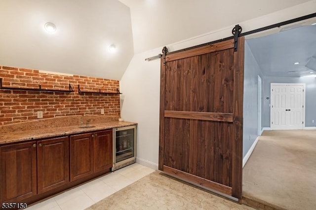 134 Milton Rd, Sparta Twp, NJ 07871 - bar area with beverage cooler, a barn door, and vaulted ceiling