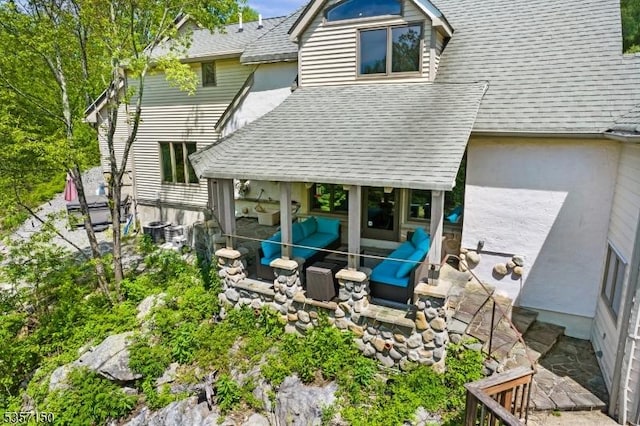 134 Milton Rd, Sparta Twp, NJ 07871 - back of house featuring a shingled roof, a patio, and an outdoor living space