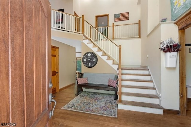 134 Milton Rd, Sparta Twp, NJ 07871 - entryway featuring a towering ceiling, stairs, and wood finished floors