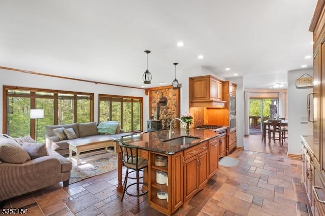 134 Milton Rd, Sparta Twp, NJ 07871 - kitchen with open floor plan, stone tile flooring, recessed lighting, dark stone countertops, and a breakfast bar