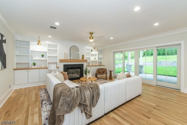 157 Meyersville Rd, Chatham Twp, NJ 07928 - living room with ornamental molding, light wood-style flooring, a ceiling fan, a glass covered fireplace, and recessed lighting