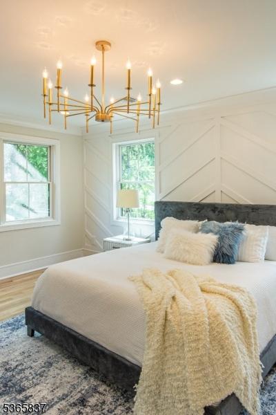 157 Meyersville Rd, Chatham Twp, NJ 07928 - bedroom with a chandelier and wood finished floors
