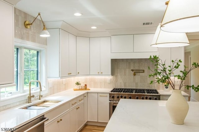157 Meyersville Rd, Chatham Twp, NJ 07928 - kitchen featuring appliances with stainless steel finishes, light countertops, tasteful backsplash, decorative light fixtures, and recessed lighting