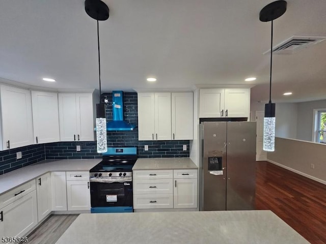 43 Rockport Rd, Wantage Twp, NJ 07461 - kitchen with stainless steel appliances, wall chimney range hood, wood finished floors, tasteful backsplash, and recessed lighting