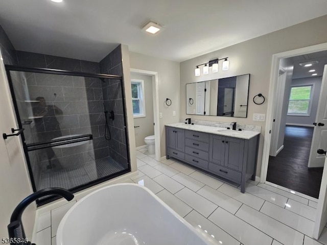 43 Rockport Rd, Wantage Twp, NJ 07461 - bathroom with double vanity, a stall shower, a freestanding tub, and tile patterned floors